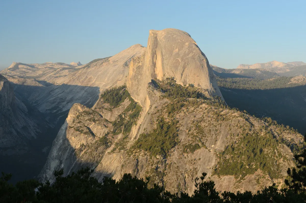 Half Dome seen from Glacier Point at golden hour on a Yosemite tour from San Francisco, California