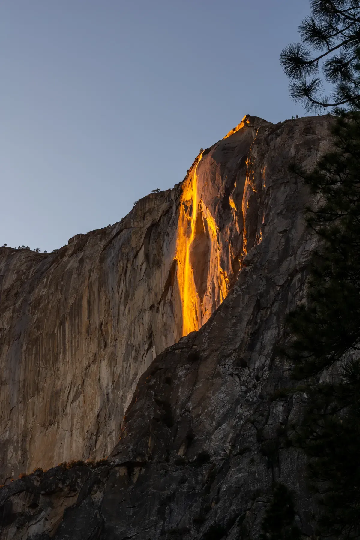 The Horsetail Fall firefall glowing on El Capitan on a February Yosemite tour from San Francisco, California